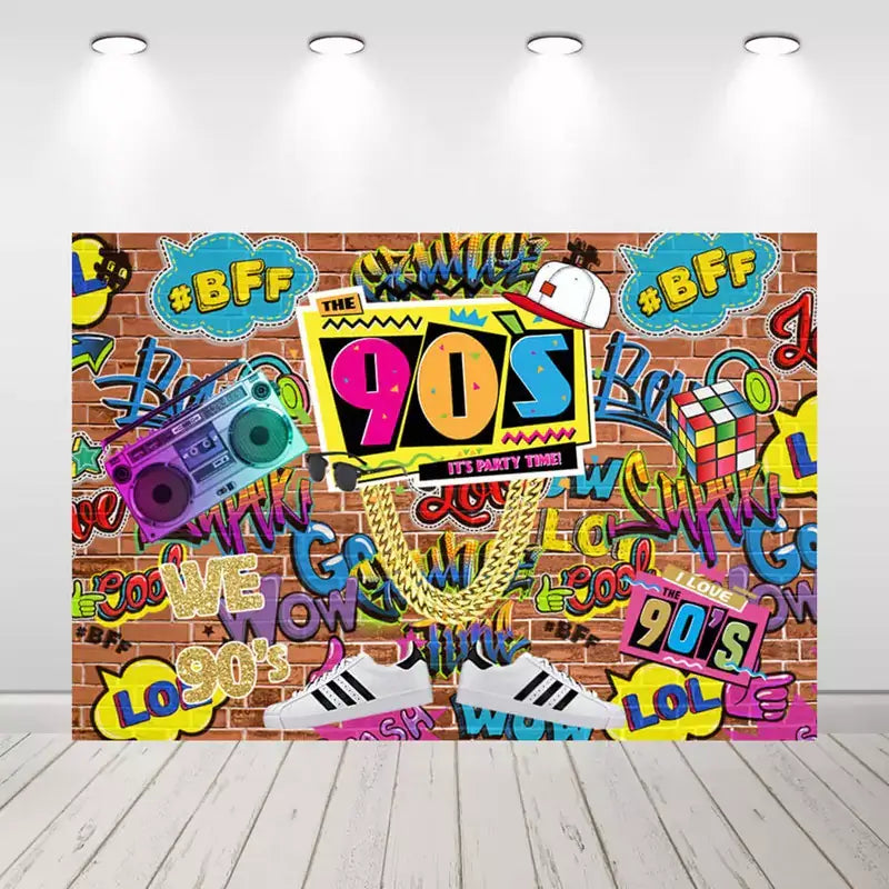 90s-themed party backdrop with brick wall, graffiti art, colorful boombox, gold chains, sneakers, and Rubik's cube – perfect for retro birthday celebrations
