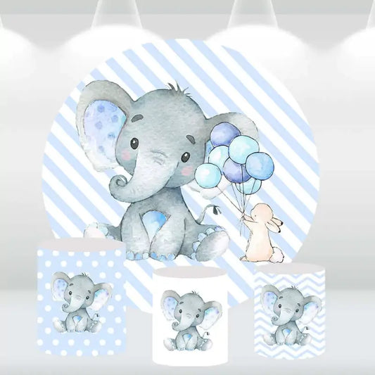Elephant-themed party backdrop with cylinder covers featuring polka dots, chevron, and elephant prints, ideal for baby showers and birthdays.