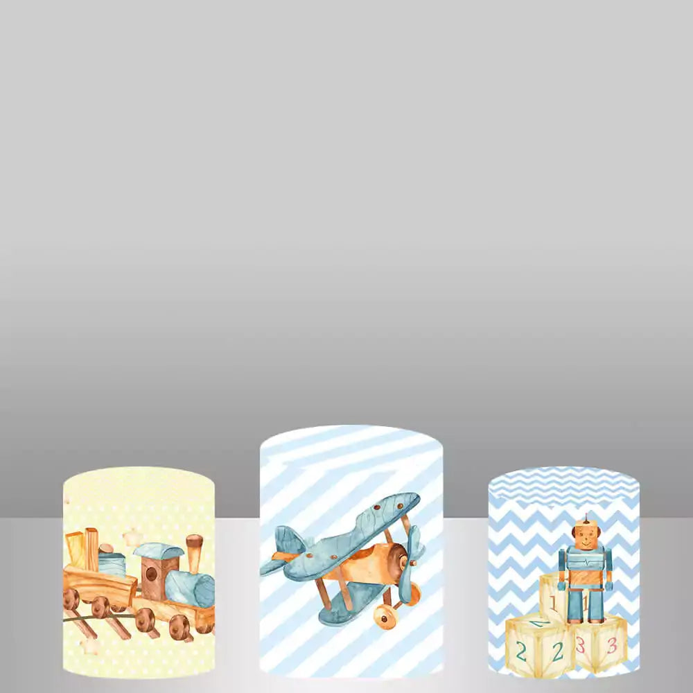 Three cylinder covers with matching toy-themed designs, including toy trains, airplanes, and blocks, perfect for baby showers and kids' parties.