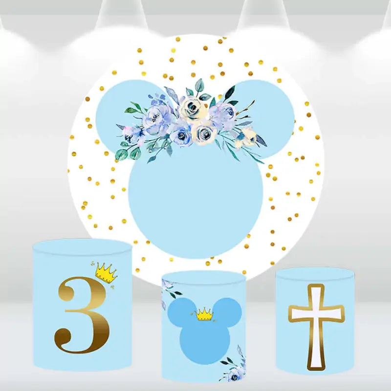 Elegant mouse ears-themed party decor set featuring a blue and gold floral backdrop and three cylinder covers with cross, number 3, and mouse ears designs.