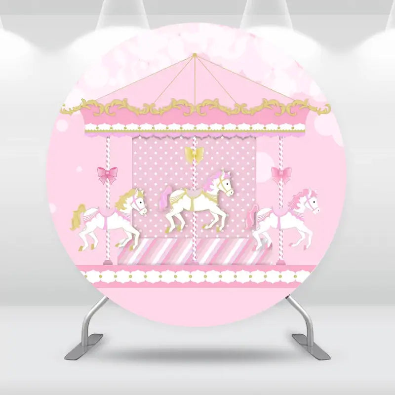 Carousel-themed round backdrop with pink and gold accents, featuring white carousel horses on a pink background, ideal for party décor