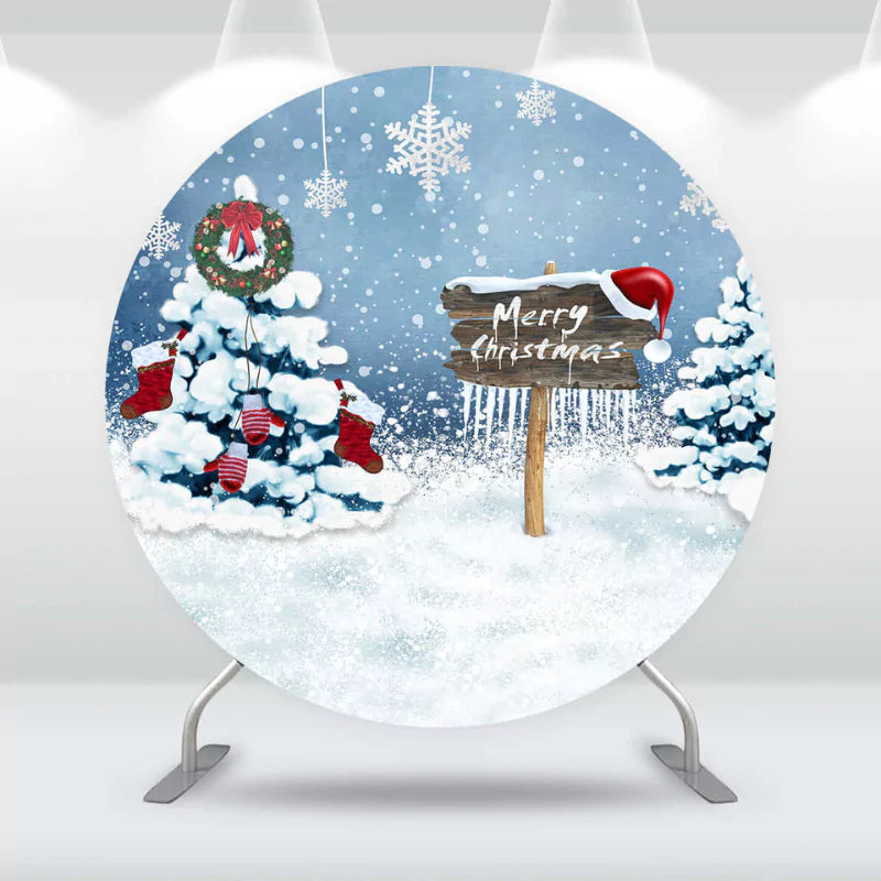 Round Christmas-themed backdrop with a snowy scene, decorated Christmas trees, stockings, a wreath, and a 'Merry Christmas' sign, perfect for holiday parties.