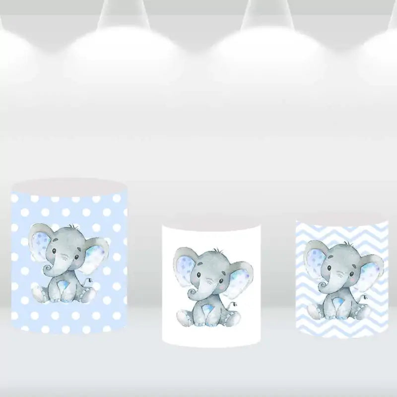 Elephant-themed cylinder covers with polka dots, chevron patterns, and elephant prints, coordinating with the party backdrop.