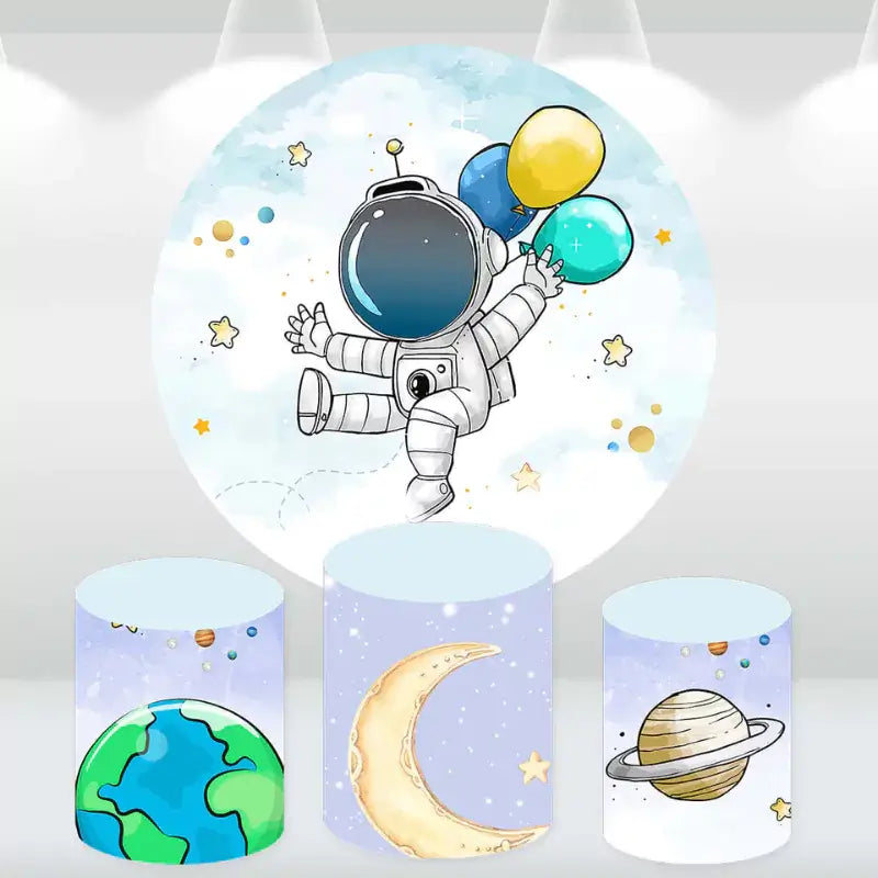 Outer space-themed party decor set with a round backdrop featuring an astronaut holding balloons in space, along with matching cylinder covers depicting planets, Earth, and a crescent moon.