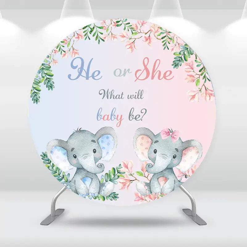 Round backdrop with "He or She, What will baby be?" text and elephant illustrations.