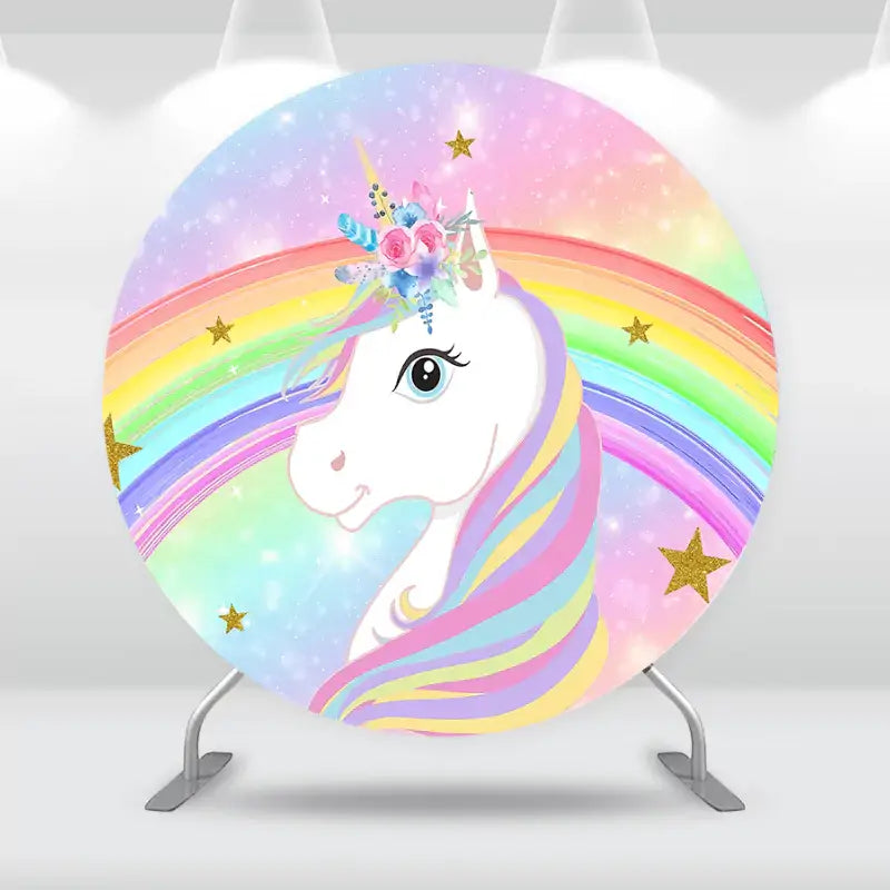 Fantasy unicorn party backdrop featuring a white unicorn with a colorful rainbow mane and glittering golden stars.