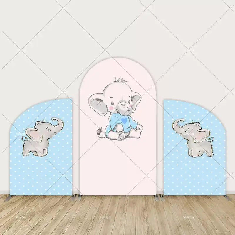 Three-panel arch backdrop featuring a cute baby elephant in a blue onesie with a heart, surrounded by two polka dot side panels with elephants.