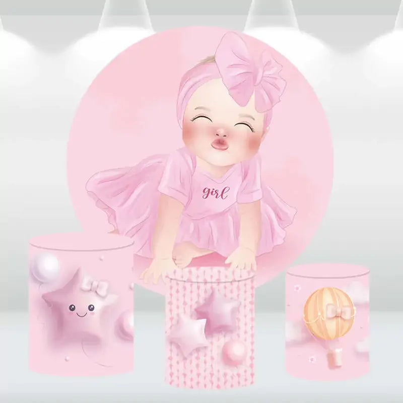 Round backdrop with a smiling baby girl in a pink dress and matching cylinder covers with stars and hot air balloon designs, perfect for baby showers and birthday parties.