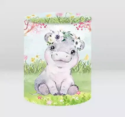 baby hippo backdrop cylinder cover with floral crown in grassy jungle scene