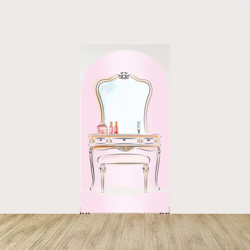 Elegant vanity table with a vintage mirror on a soft pink background, adorned with perfume bottles and other beauty items for a sophisticated vibe.