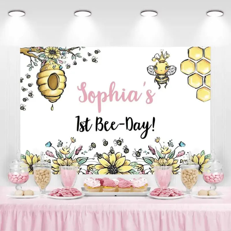 Sophia’s 1st Bee-Day birthday backdrop with sunflowers and honey bees.