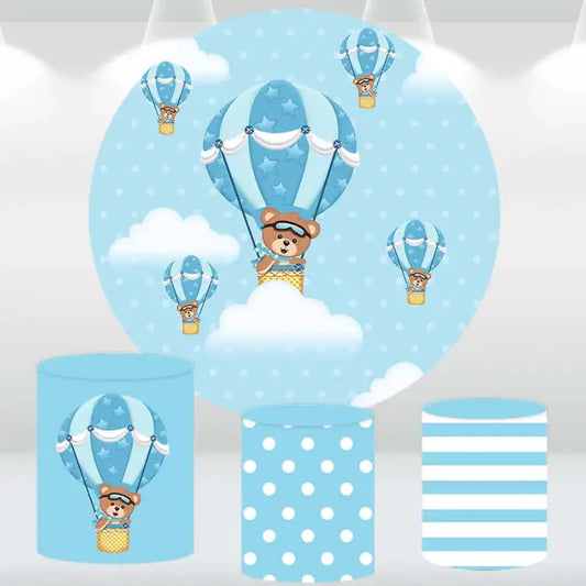 Blue hot air balloon and teddy bear-themed round backdrop with three matching cylindrical pedestal covers featuring polka dots and stripes.