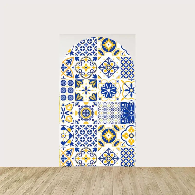 Arch panel showcasing an intricate mosaic of blue, yellow, and white Mediterranean tiles—perfect for Italian-themed decor and festive gatherings.