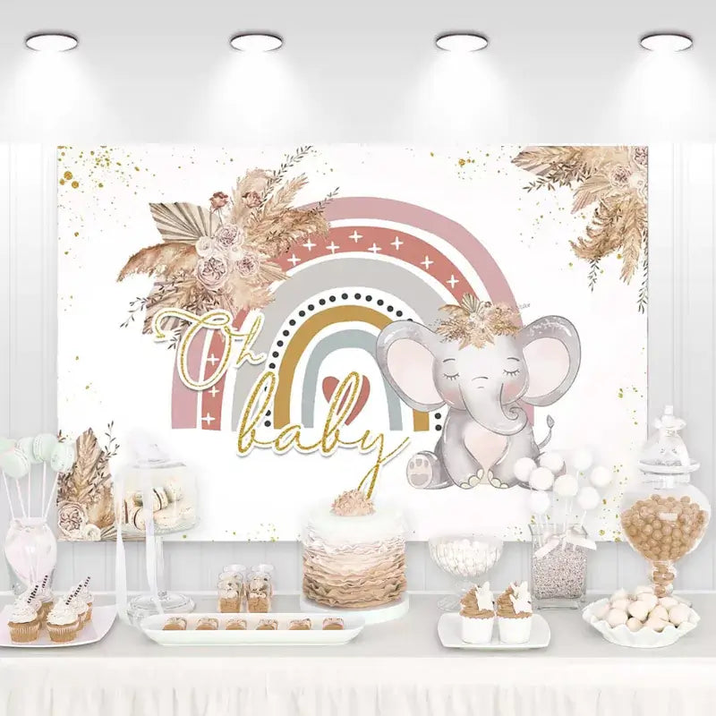 Neutral boho baby shower backdrop with rainbow, flowers, and a cute elephant illustration.