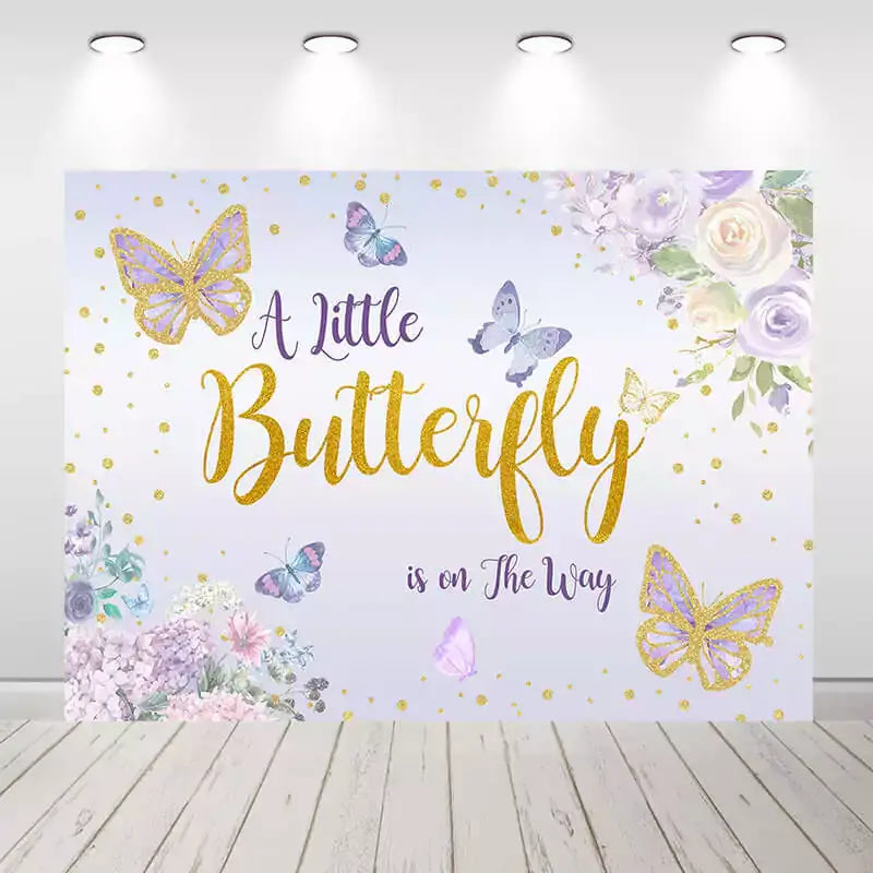 Elegant butterfly-themed baby shower banner featuring gold glitter text, pastel butterflies, and purple floral corner bouquets – ideal for welcoming a baby girl