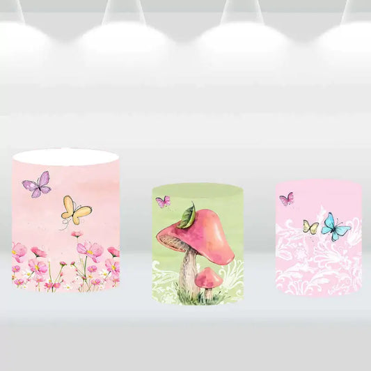 Three garden-themed backdrop cylinder covers featuring butterflies, flowers, and mushrooms