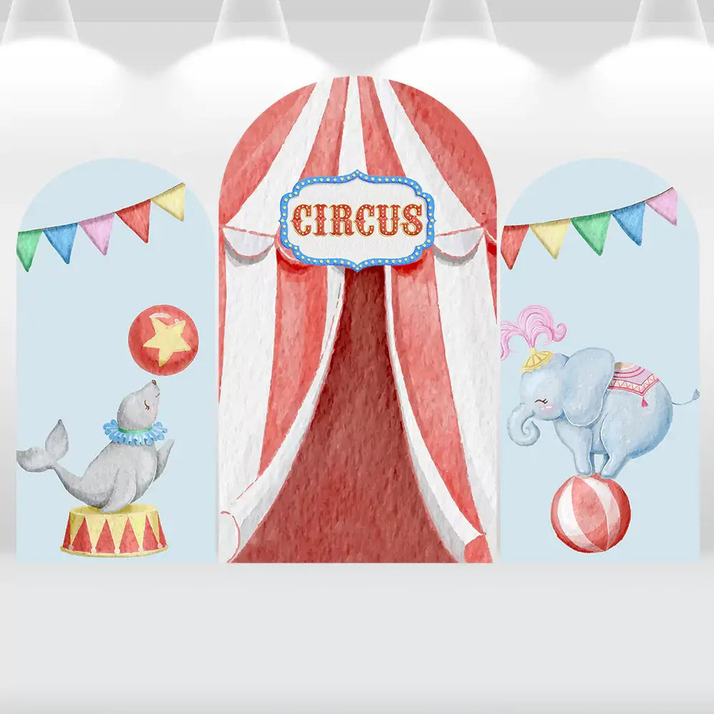 Three-panel circus-themed arch backdrop featuring a red and white striped circus tent, playful seal balancing a ball, elephant standing on a ball, and colorful pennant banners.