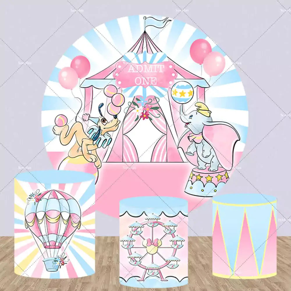 Circus-themed round backdrop featuring whimsical circus performers, a big top tent, and three matching cylindrical pedestal covers with designs of hot air balloons, Ferris wheels, and circus drums.