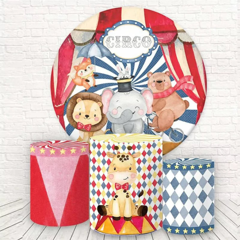 Circus-themed round backdrop with an elephant, lion, and bear, paired with three matching cylindrical pedestal covers featuring a giraffe, star patterns, and carnival designs.