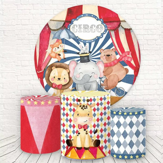 Circus-themed round backdrop with an elephant, lion, and bear, paired with three matching cylindrical pedestal covers featuring a giraffe, star patterns, and carnival designs.