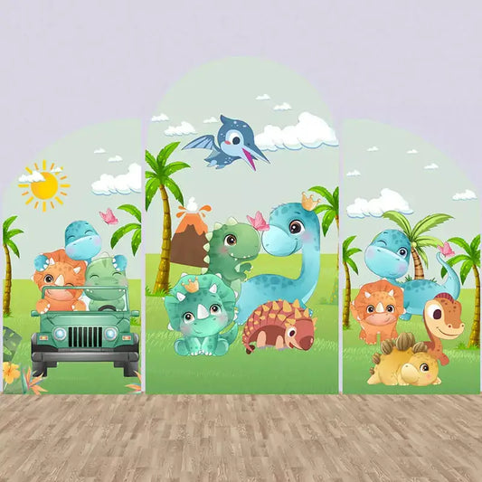Three-panel dinosaur party arch backdrop featuring cute cartoon dinos, palm trees, jeep, volcano, and grassy prehistoric setting.