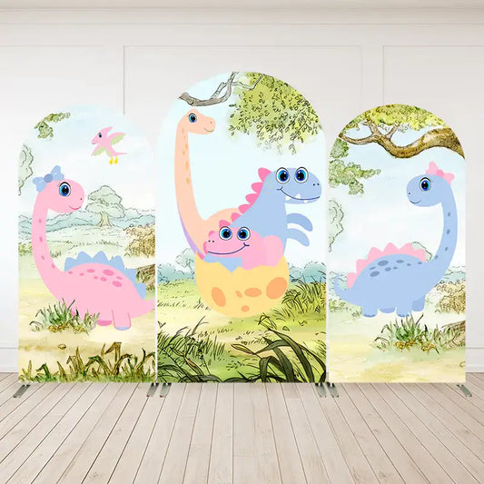 Three-panel dinosaur arch backdrop featuring cute pink and blue dinosaurs, baby dino hatching from an egg, and a nature-filled landscape background.