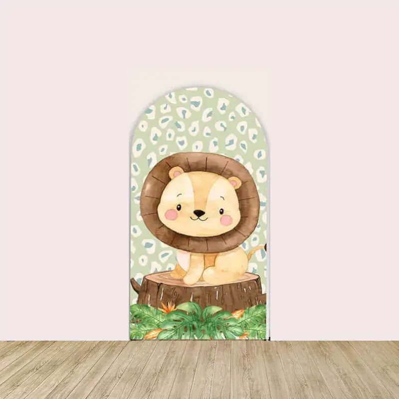 Left arch with pastel green leopard print and a baby lion sitting on a tree stump surrounded by jungle leaves.