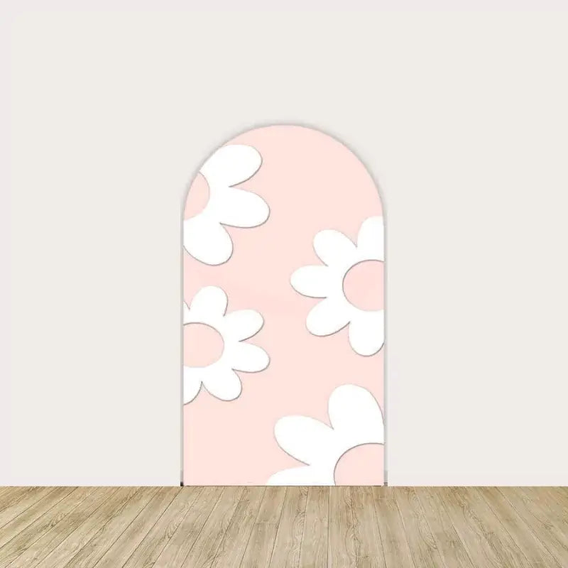 Soft peach backdrop with large white and pink daisy prints.