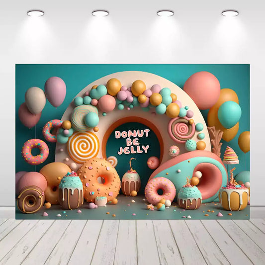 Colorful pastel donut birthday backdrop with cupcakes, balloons, candy swirl and 'Donut Be Jelly' sign – perfect for a dessert-themed celebration