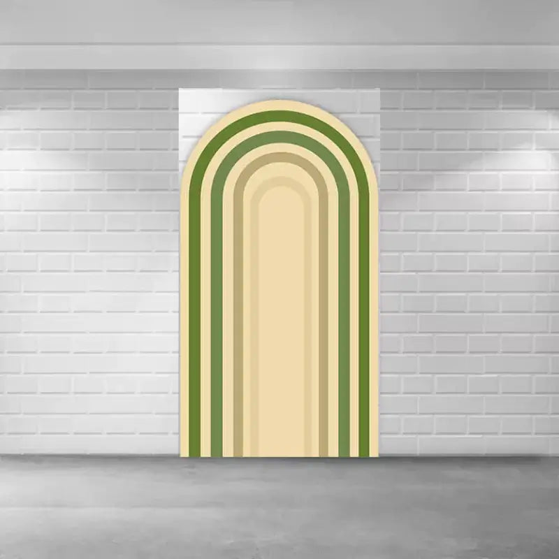 Arched backdrop with layered neutral and green rainbow design, adding a boho touch to baby shower decor.