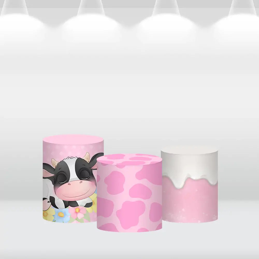 Cylinder covers with a dripping cream design in soft pink, part of the cow-themed party decor set.