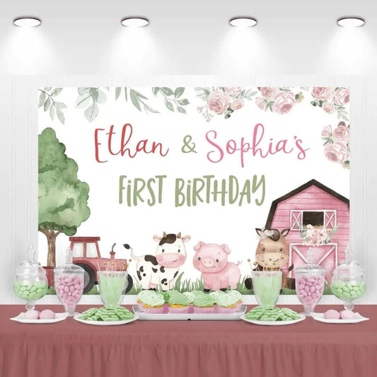 Ethan and Sophia's farm-themed first birthday backdrop with pink barn and animals.