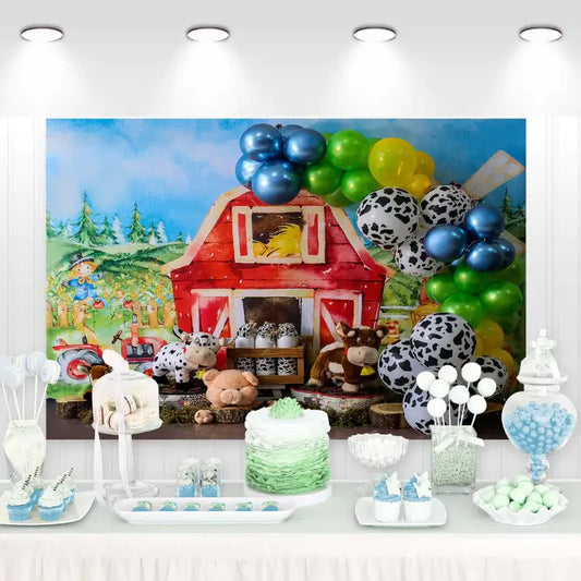 Farm-themed birthday party backdrop with red barn, cow, pig, and horse plush toys, green pastures, and balloon decorations – perfect for kids’ farm birthday celebrations