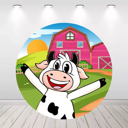 Cartoon cow smiling in front of pink barn farm backdrop for kids' party.