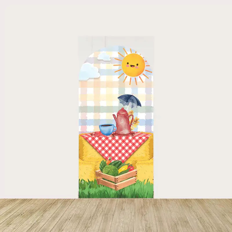 Right panel featuring a cheerful sun, picnic table with coffee pot and cup, crate of vegetables, and hay bale on a warm plaid background—perfect for a country-themed celebration.