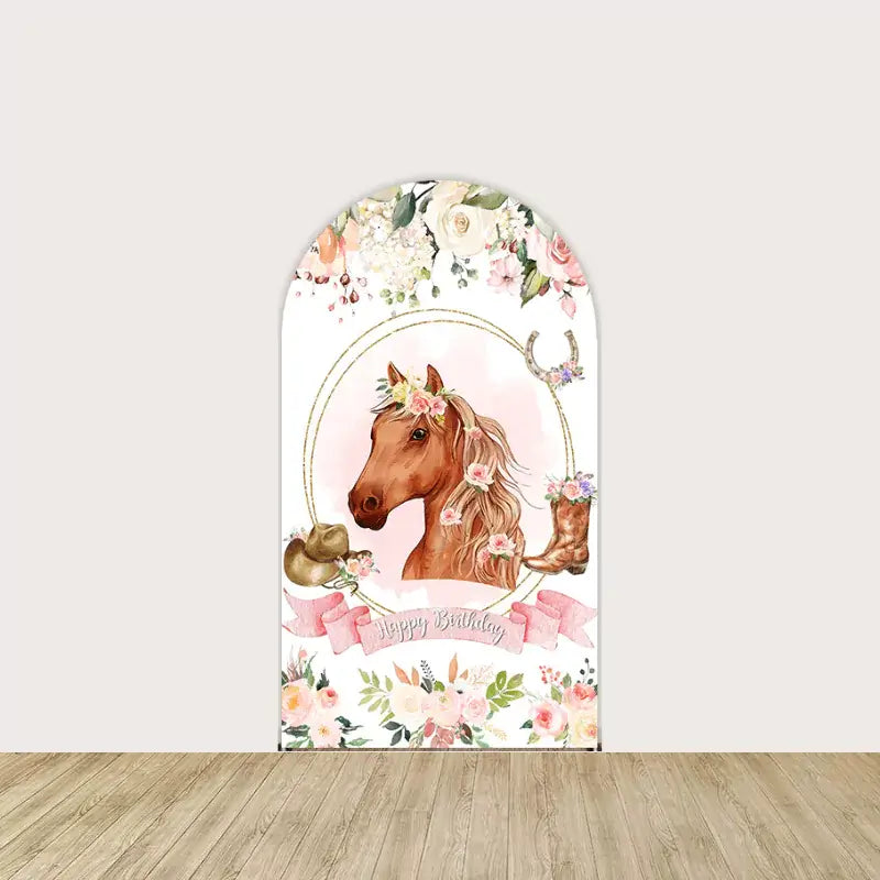 Arch backdrop with illustrated floral horse, pink ribbon banner saying “Happy Birthday,” and decorated with hats, boots, and flowers.