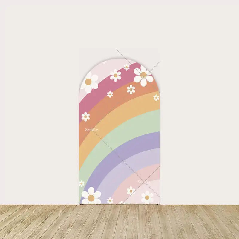 Pastel rainbow with white daisies on a pink background.
