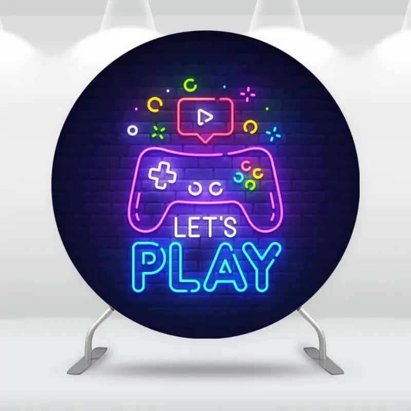 Gamer-themed neon round backdrop with a glowing game controller and 'Let's Play' text, ideal for video game-themed birthdays and celebrations.