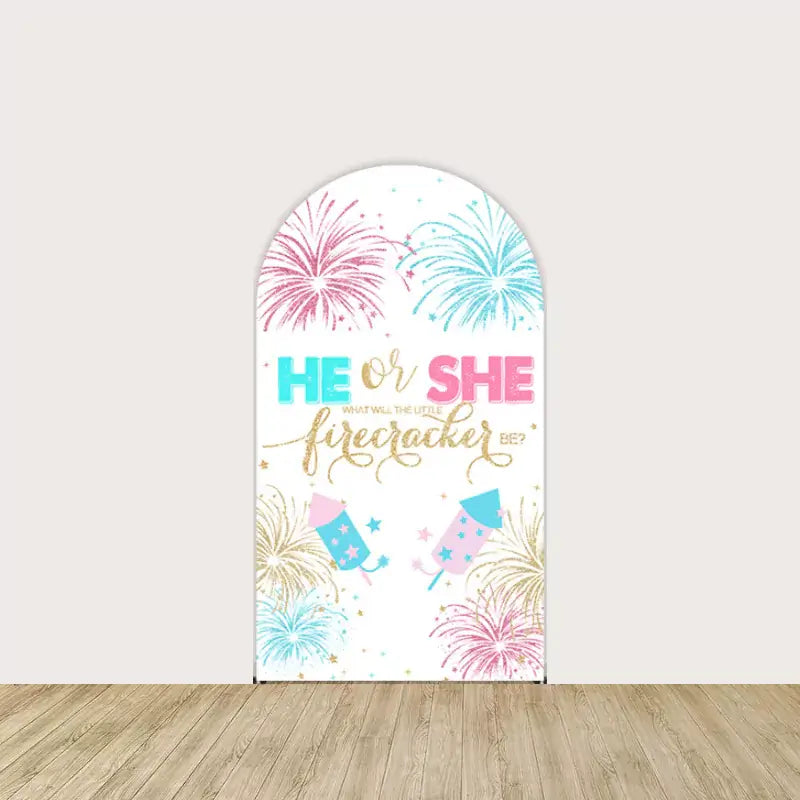 Arch backdrop with colorful fireworks, pink and blue rockets, and "He or She – What Will the Little Firecracker Be?" text.