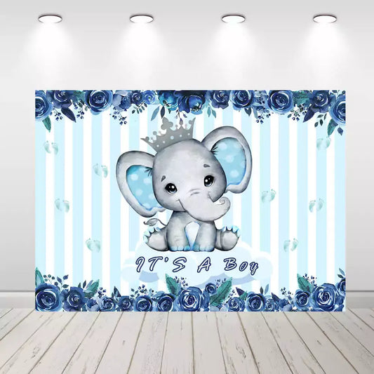 Blue striped baby shower backdrop with adorable baby elephant wearing a crown, blue floral accents, and ‘It’s a Boy’ text – perfect for welcoming a baby boy