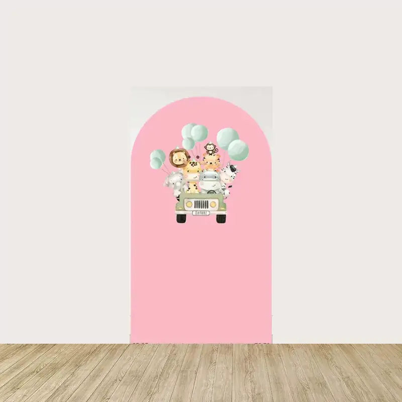 Arch panel with pink background featuring a safari jeep carrying cute animals like lion, giraffe, elephant, and zebra with pastel balloons—ideal for girls’ jungle celebrations.