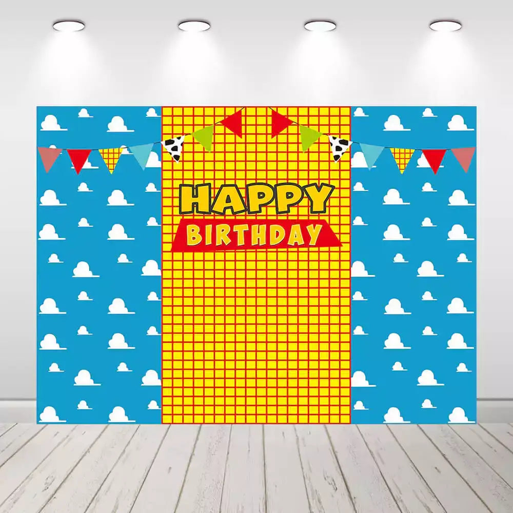 Kids’ birthday party backdrop featuring clouds and banners in a colorful theme, ideal for birthday celebrations.