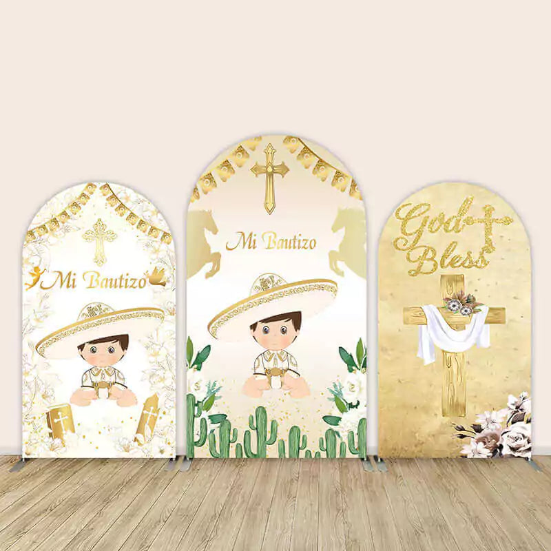 Three-panel Mi Bautizo arch backdrop featuring baby boy in Mexican attire with crosses, cacti, and gold religious themes, including “God Bless.”