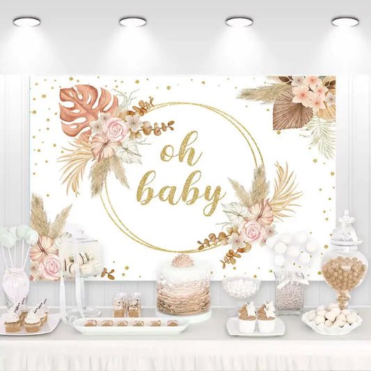Boho baby shower backdrop with gold 'Oh Baby' lettering, dried floral arrangements, pampas grass, and soft pastel roses – perfect for neutral or elegant baby showers