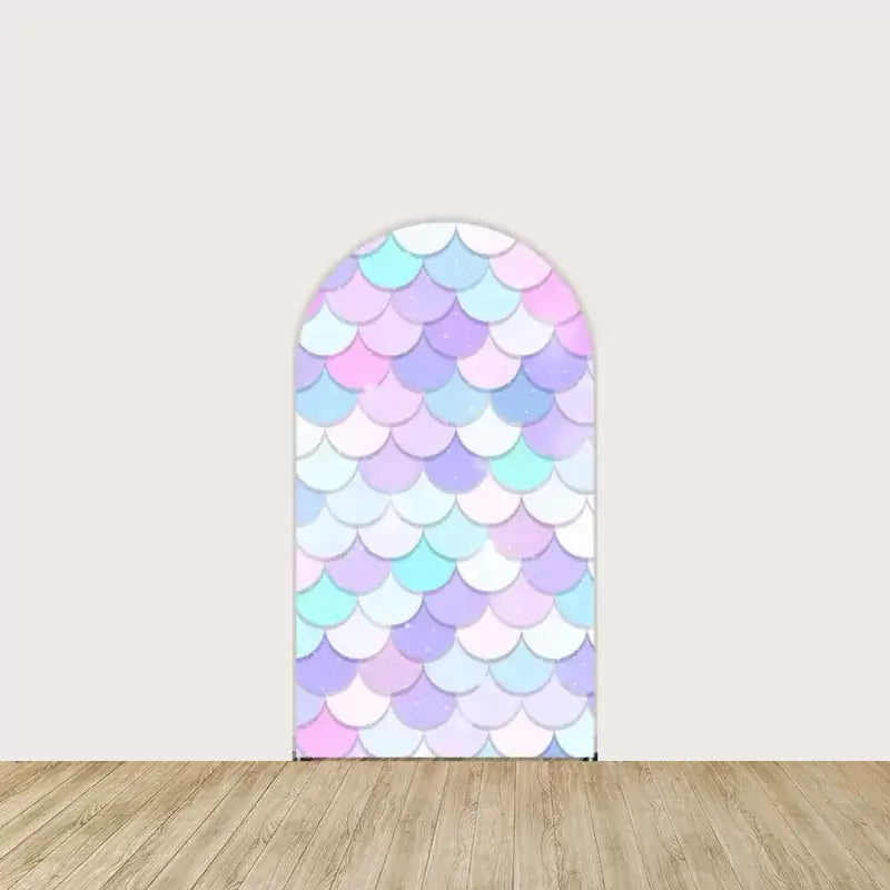 Arch panel with repeating pastel mermaid scales in blue, pink, purple, and aqua—ideal for under-the-sea themed birthday decorations.