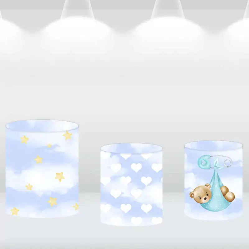 Three matching cylinder covers with hearts, stars, and teddy bear designs, complementing a teddy bear on moon-themed backdrop.