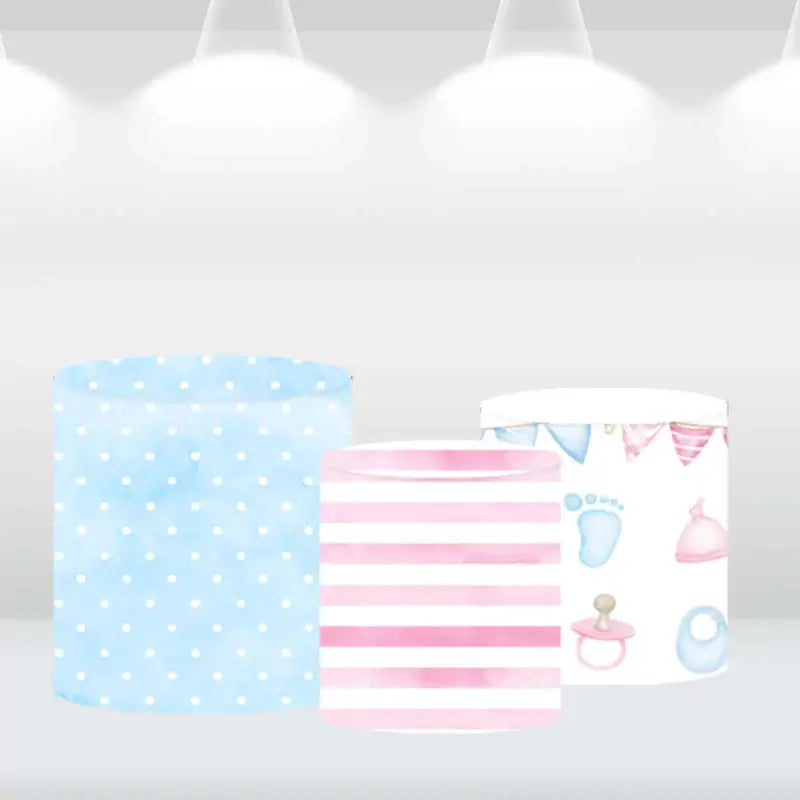 Three matching cylindrical covers with pastel designs of polka dots, stripes, and baby-themed patterns, ideal for baby showers and gender reveal events.