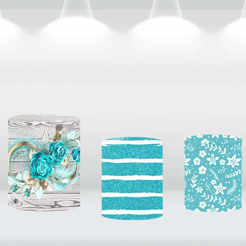Three cylinder covers featuring turquoise glitter, floral, and wood grain patterns, designed to complement a turquoise rose-themed backdrop.