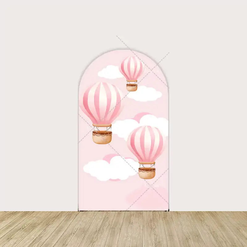 Left panel featuring pink striped hot air balloons floating among soft clouds—whimsical and light design for a dreamy baby event.