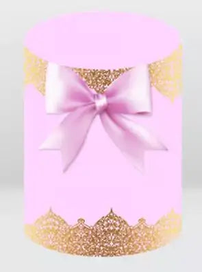 pink backdrop cylinder cover with gold lace design and satin bow accent